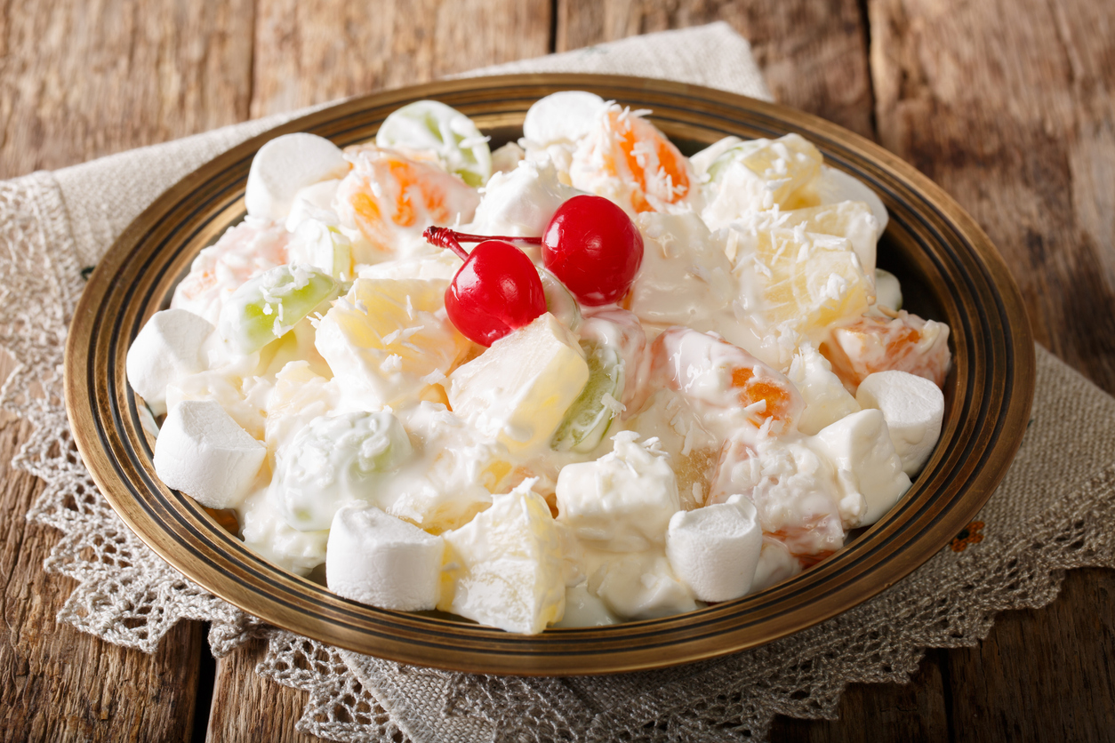 fruit-salad-from-pineapple-oranges-grapes-and-coconut-with-marshmallow-and-vanilla-yogurt-close-up-horizontal